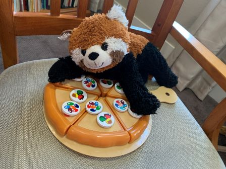 Bobby eating pizza with candy on it